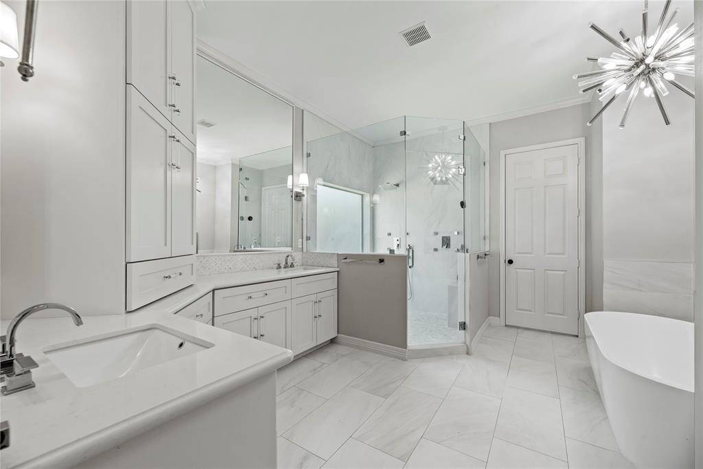 This primary bath is truly a luxurious retreat!