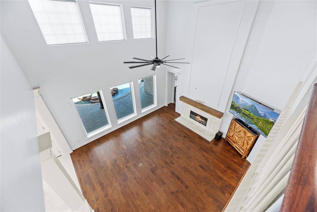 The breezeway offers open views of the family room and is filled with natural light from the double stacked windows.
