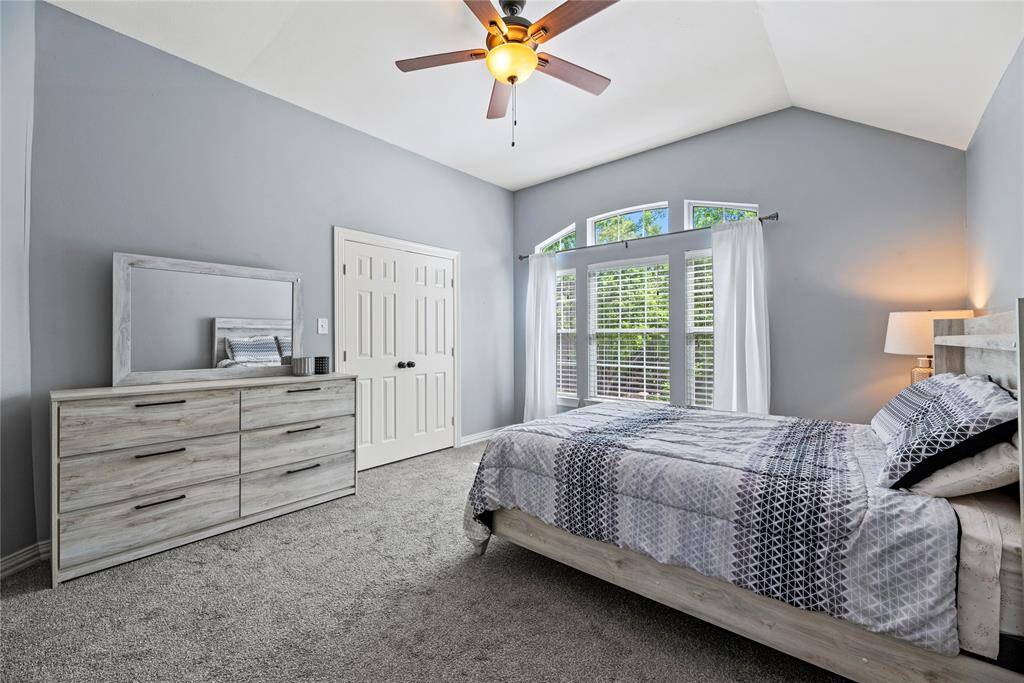 Secondary bedroom is cozy with plush carpeting and is conveniently next to a full bath.