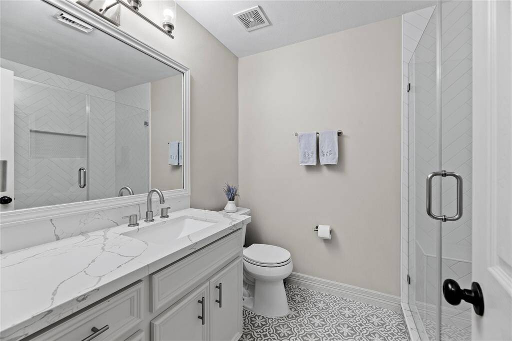 Beautifully updated bathroom. Ample counter space and large walk in shower.