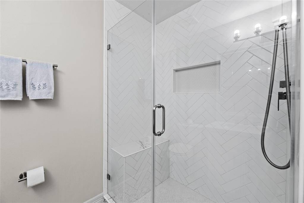 Modern and sophisticated walk in shower complete with seemless glass door.