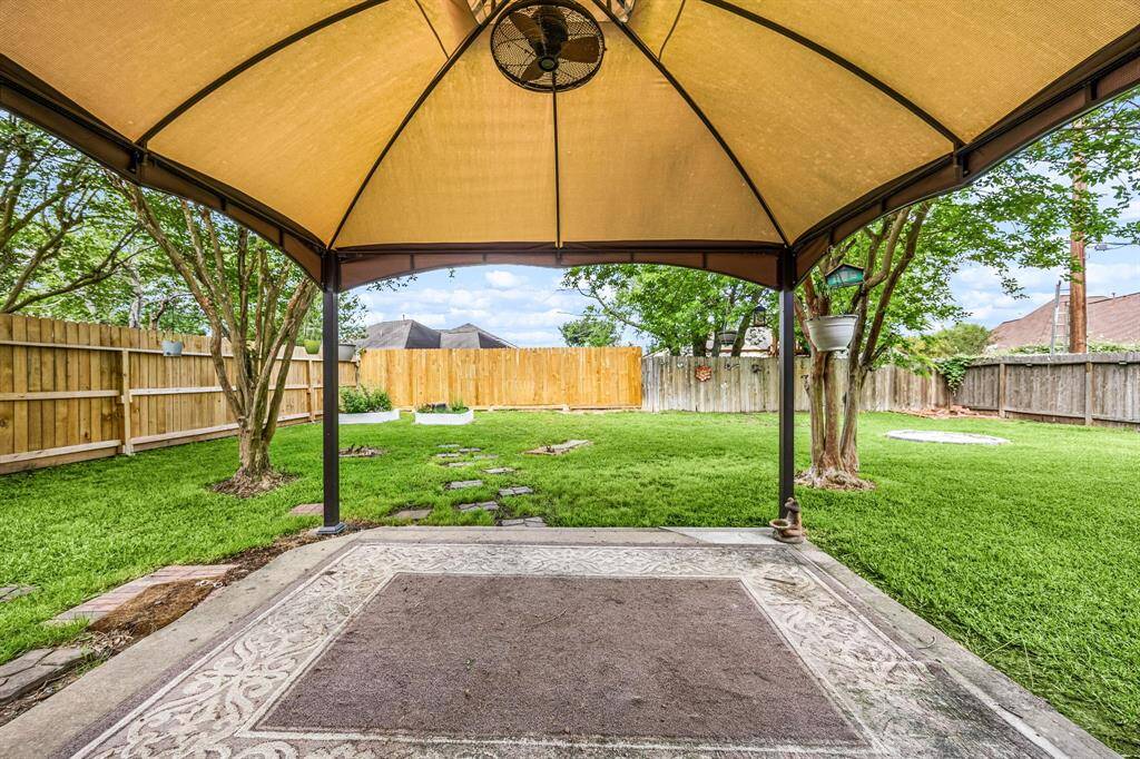 Covered patio area remains with the home.