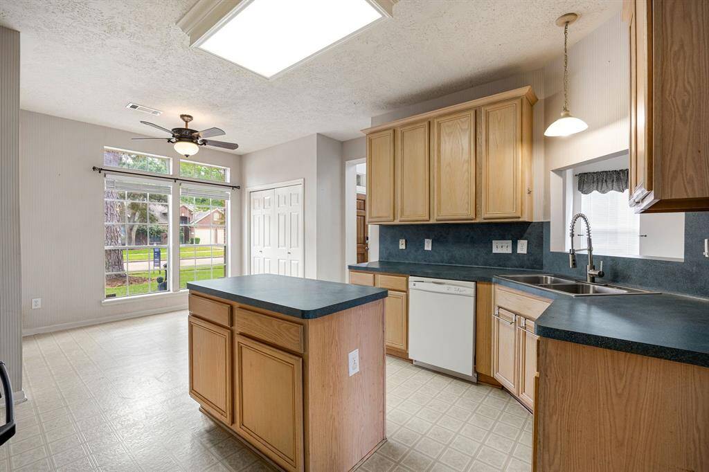 Kitchen has a gas range and lots of cabinet space.