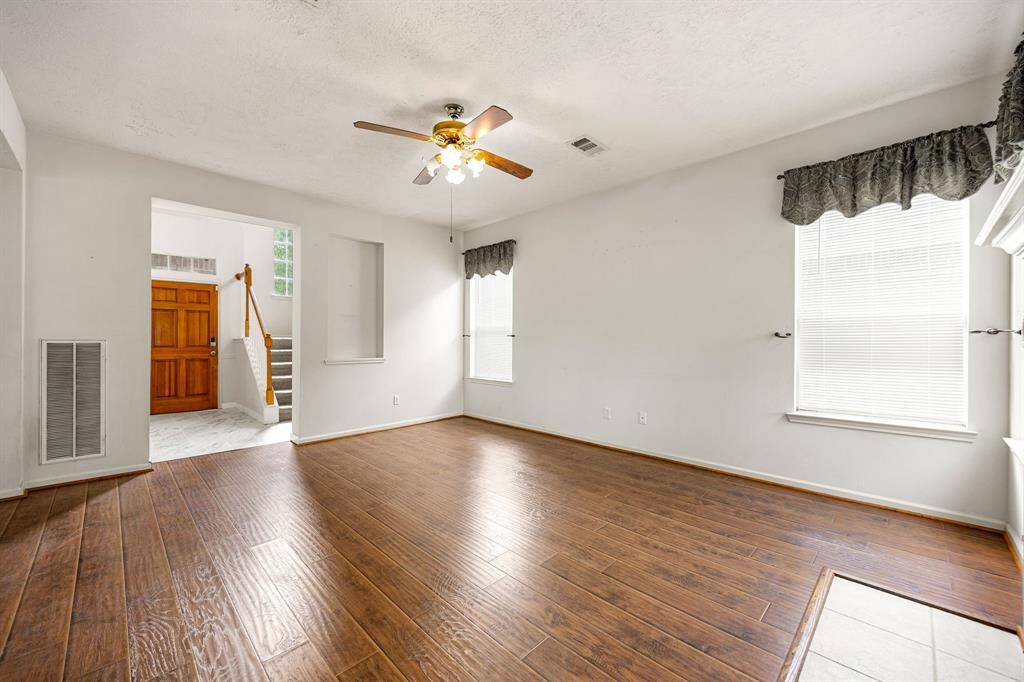 This view shows the wall separating the living room and the formal dining space.