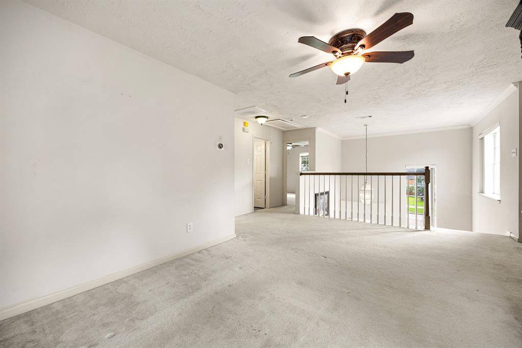 Two bedrooms are shared by the large hallway bathroom seen in this frame.