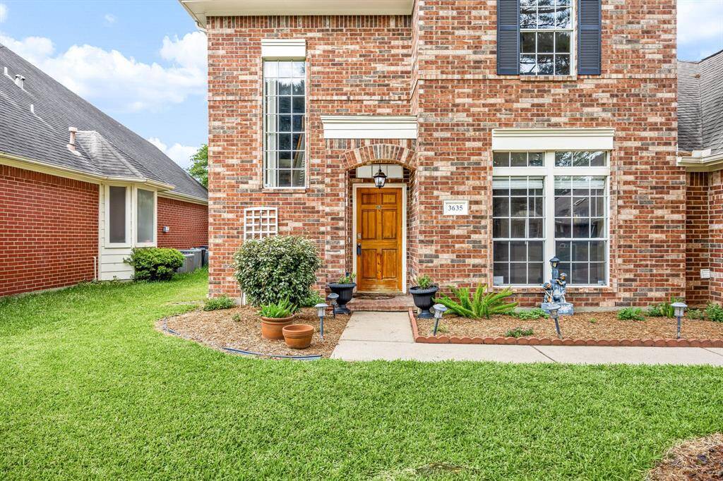 Classic front elevation with accented windows.
