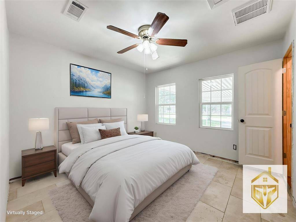 Versatile second master bedroom featuring a convenient guest kitchenette—perfect for visitors or as a private in-law suite. This unique feature adds flexibility and comfort to the home.