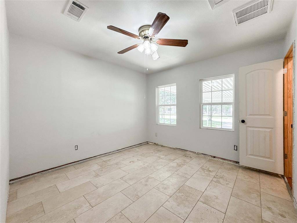 Versatile second master bedroom featuring a convenient guest kitchenette—perfect for visitors or as a private in-law suite. This unique feature adds flexibility and comfort to the home.