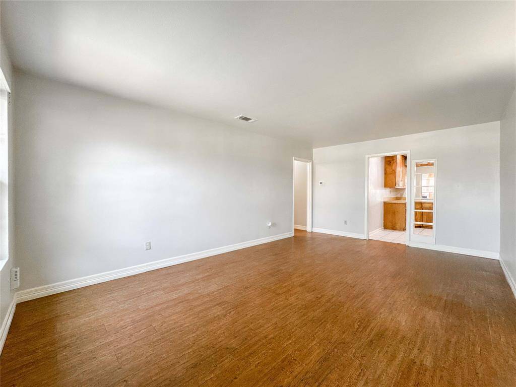 Spacious living area filled with natural light, perfect for family gatherings and entertaining. Ready for your personal touches to make it feel like home