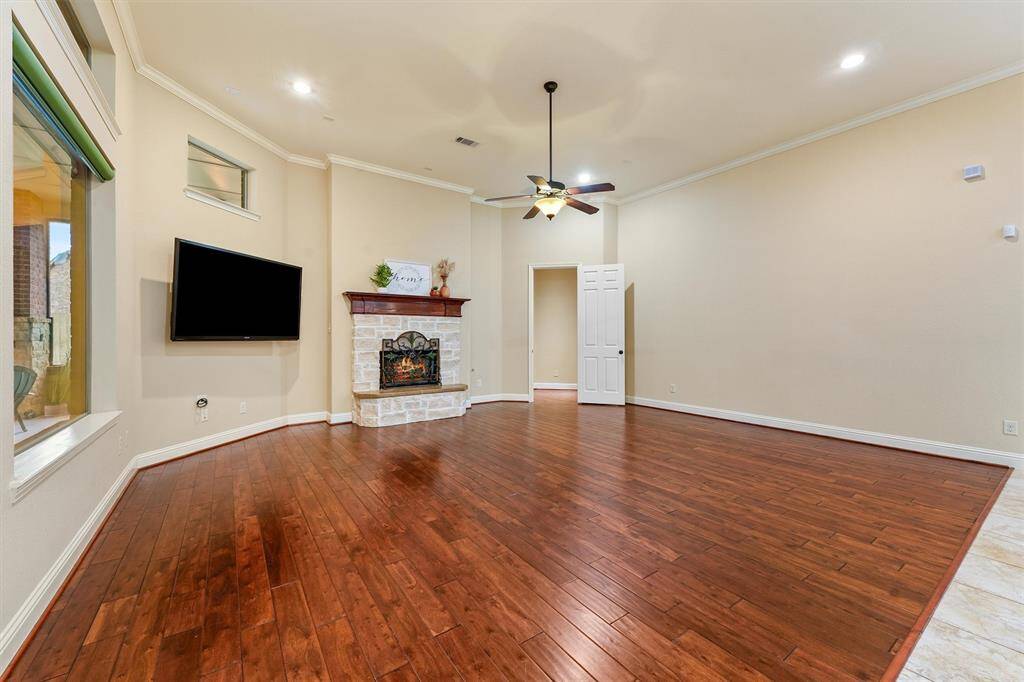 Immaculately maintained wood floors and neutral colored walls are the perfect backdrop for any style furniture. TV will convey with home.