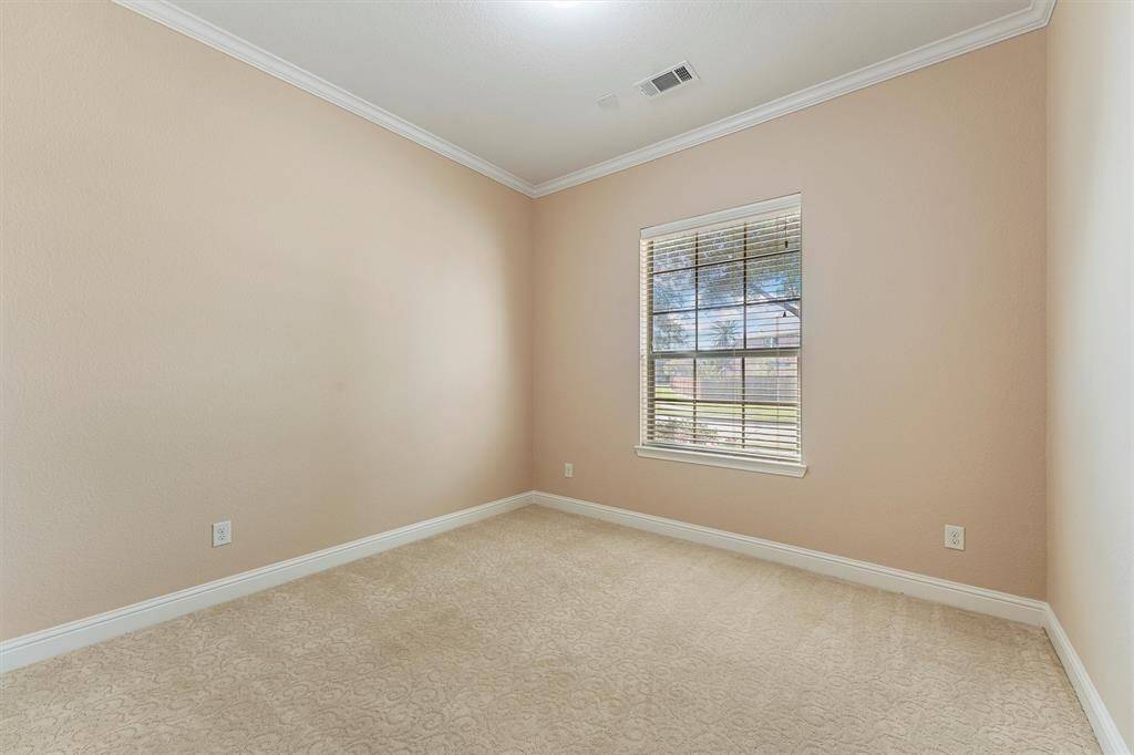 Secondary bedroom #2 is bright and airy. Entire home has crown molding.