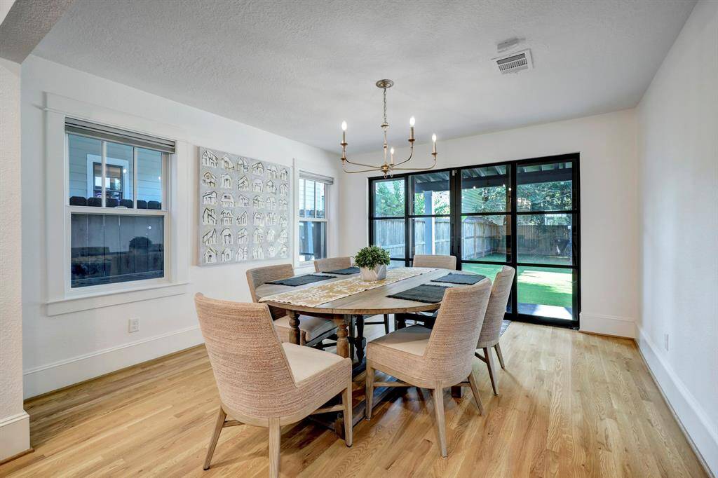Dining room overlooks the private turfed back yard and is light filled with designer finishes.