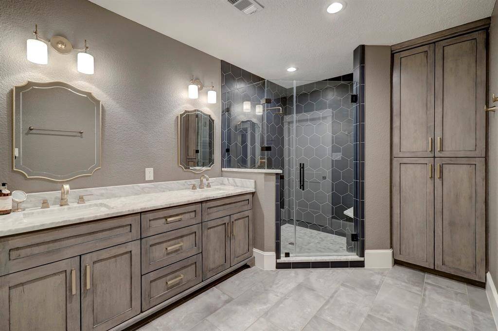 Primary bathroom is charming and features tons of storage!