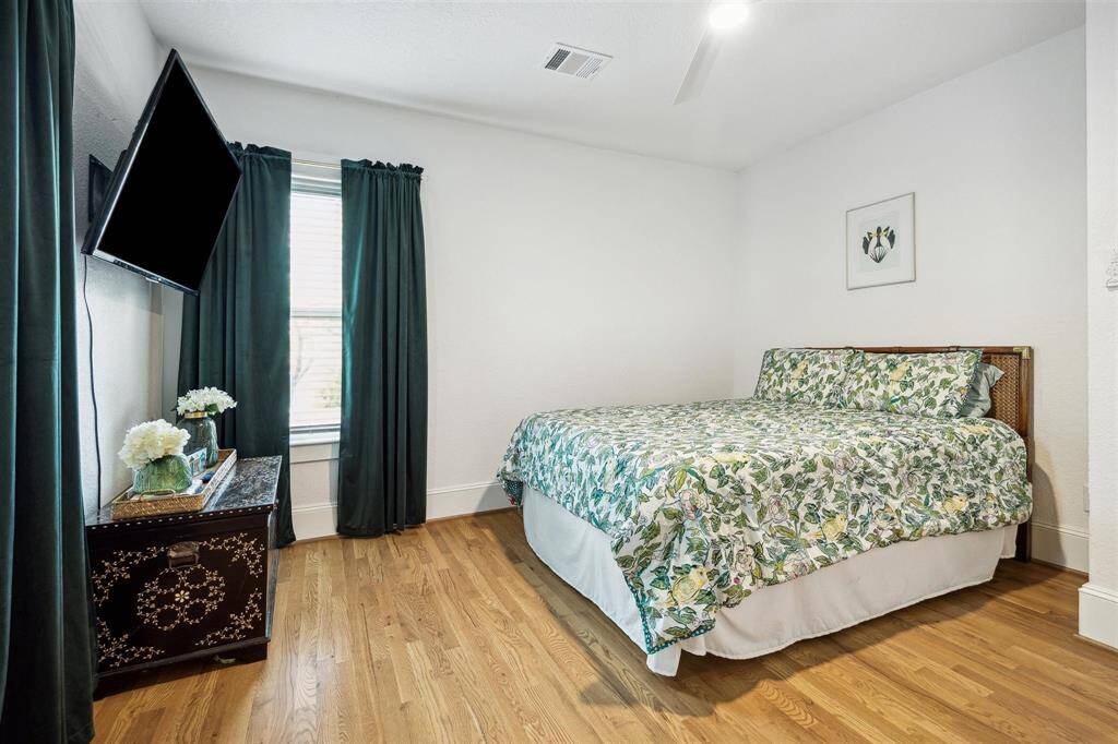 One of two upstairs secondary bedrooms overlooking back yard