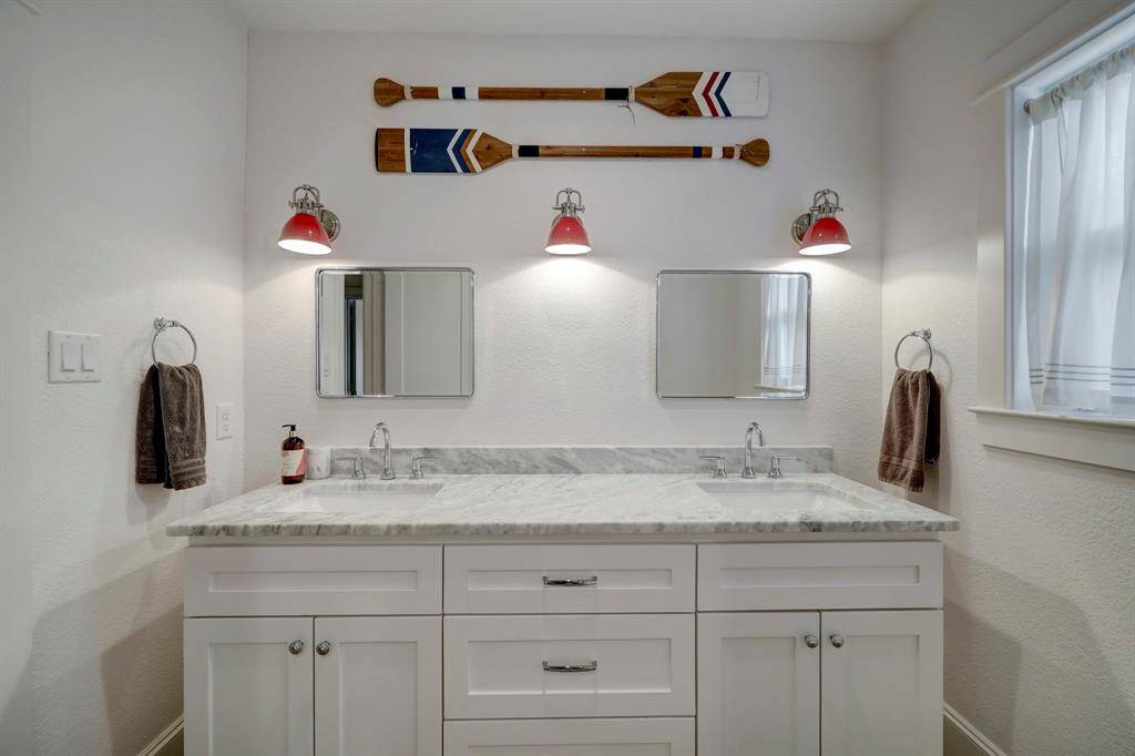 Secondary bathroom upstairs is located in hall perfect for guests in game room or two secondary bedroom occupants.