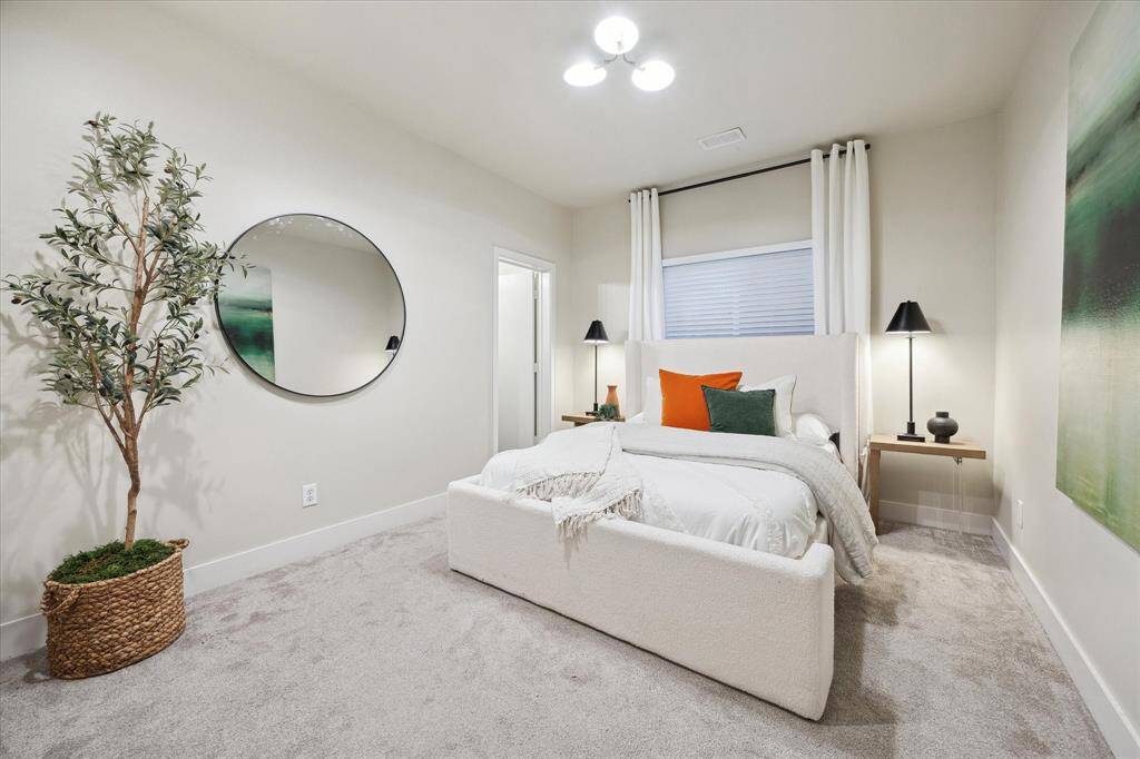 [First Level Bedroom 11 x 15] Just off the entry -  ideal as a bedroom with the ensuite bath.