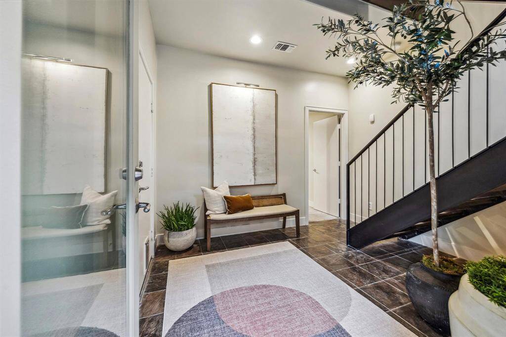 [Entry] The welcoming entry level offers a thoughtfully designed space with room for seating, storage, and a seamless transition into the home. Slate tiled entry, custom metal and oak hardwoods. Access to private 2-car garage.