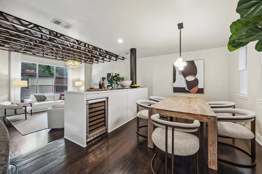[Dining Room with Bar 17 x 10] Has adjacent serving bar with wine fridge, hardwood floors, linear chandelier, space for large table and buffet.