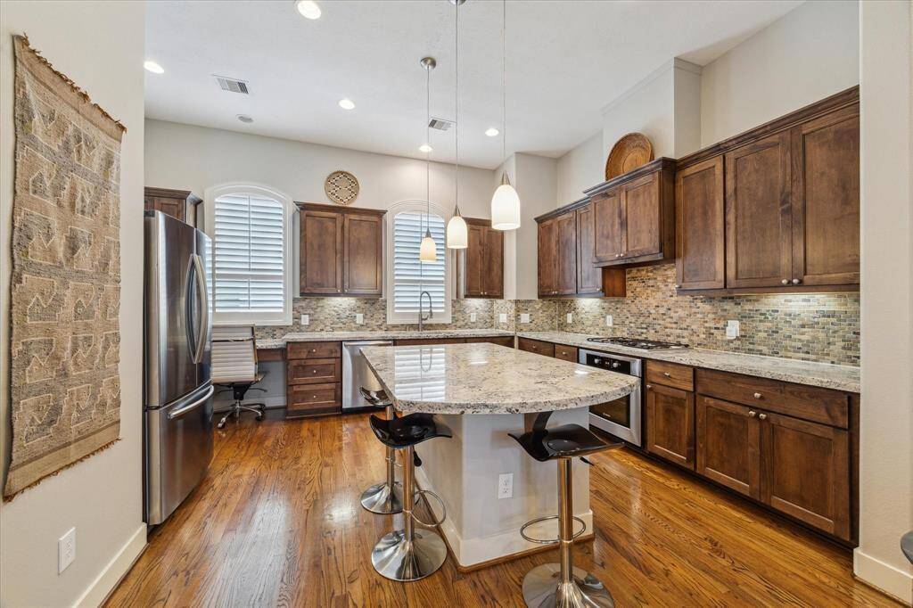 Kitchen: Also on the 2nd floor, the kitchen is open to the family room and includes an island/dining bar, stainless steel appliances, a large pantry, and under-cabinet lighting.