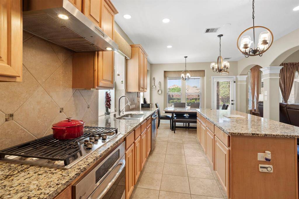 Custom wood cabinetry features soft-close cabinets and drawers.