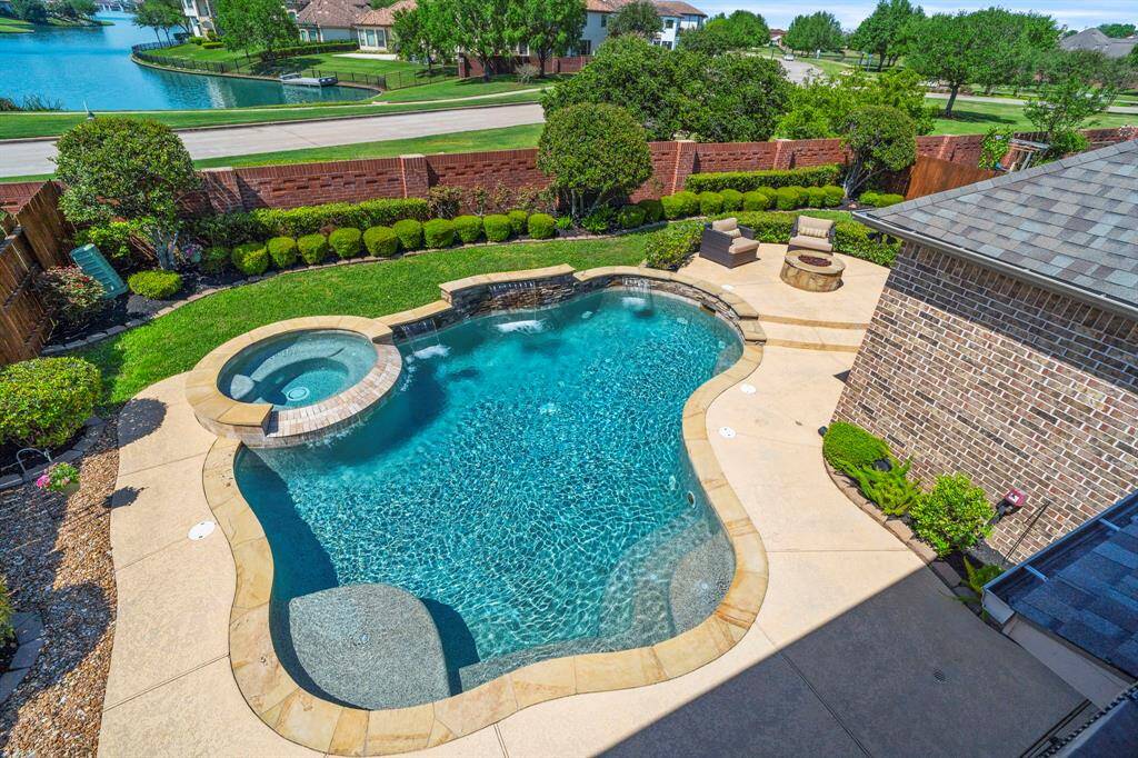 The outdoor space is truly spectacular with a heated pool, spa, and waterfall features. Your own private oasis!