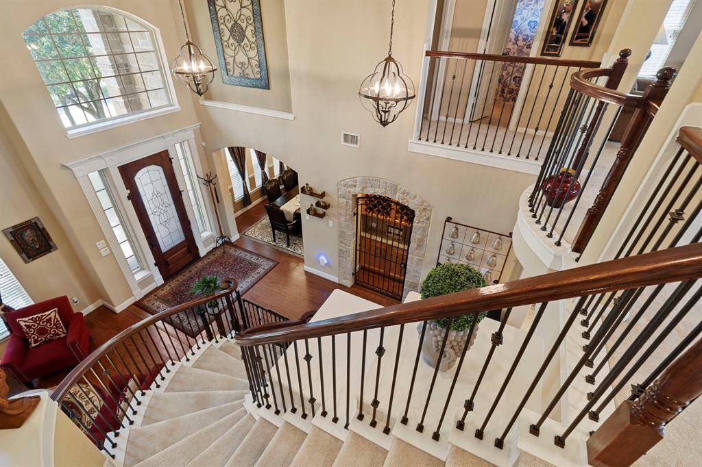 The magnificent sweeping staircase is a true showstopper, adding dramatic elegance to the home's grand entrance.