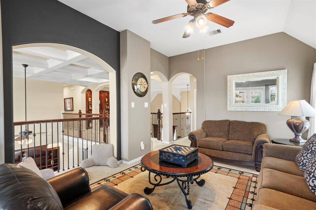 The game room offers a cozy and private upstairs living space, perfect for relaxing or entertaining.