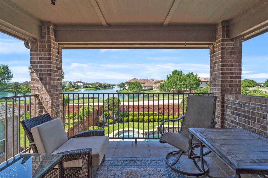 Feel the summer breeze on this delightful second floor patio overlooking the lake.