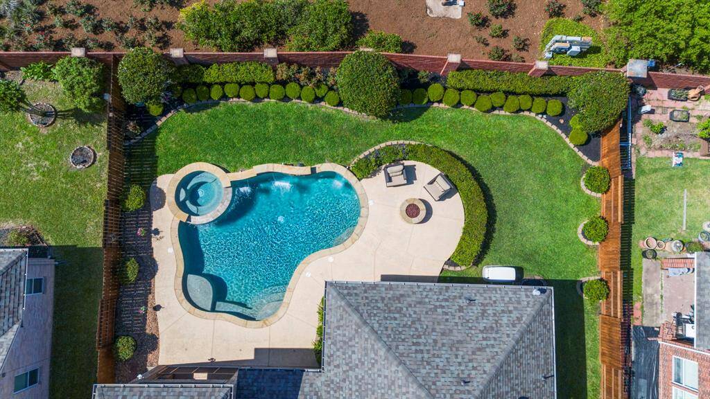 Plenty of lush, green grass provides an ideal space for pets and children to play and enjoy the outdoors.