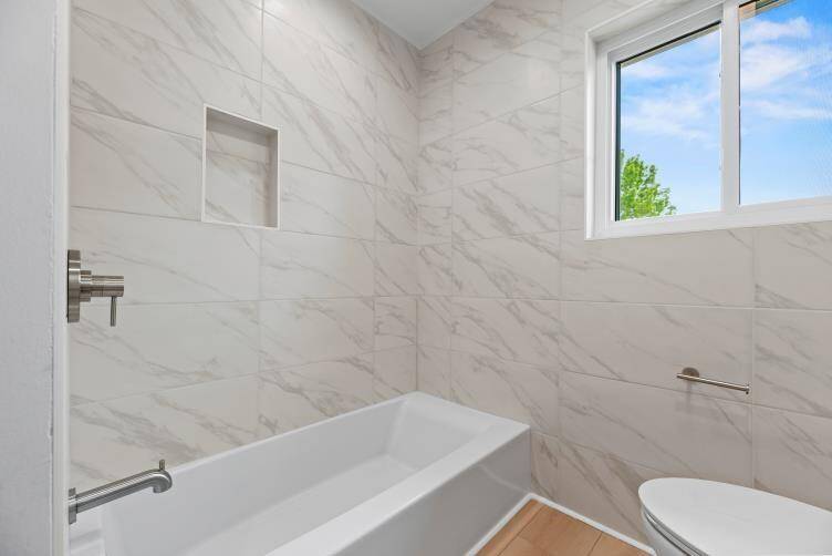 Secondary bath with modern finishes.