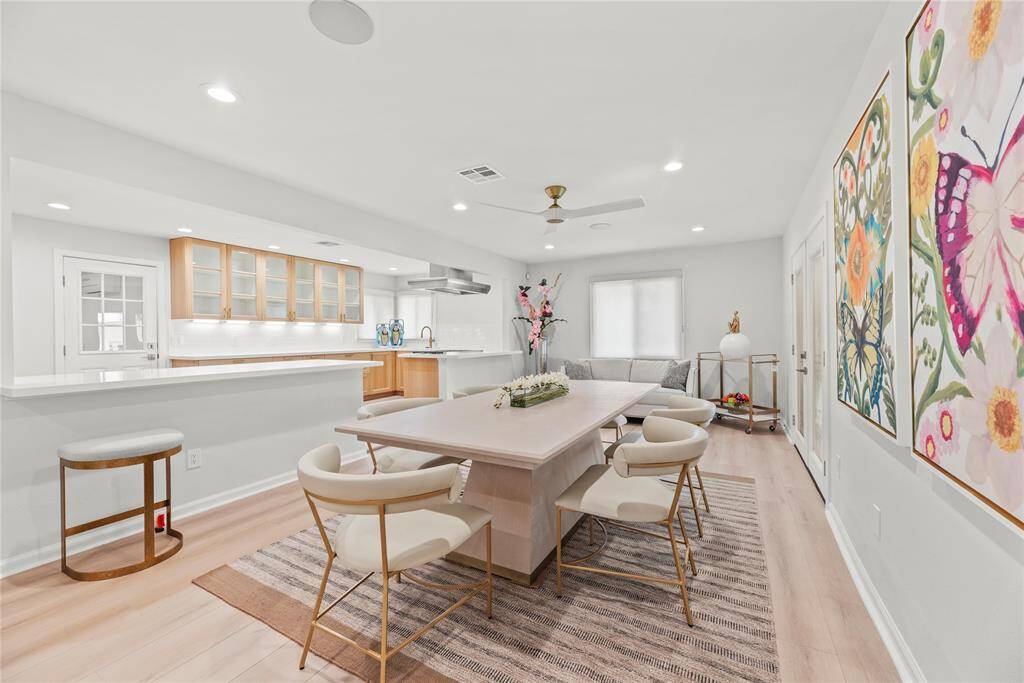 Open layout creates a seamless flow between living and dining.