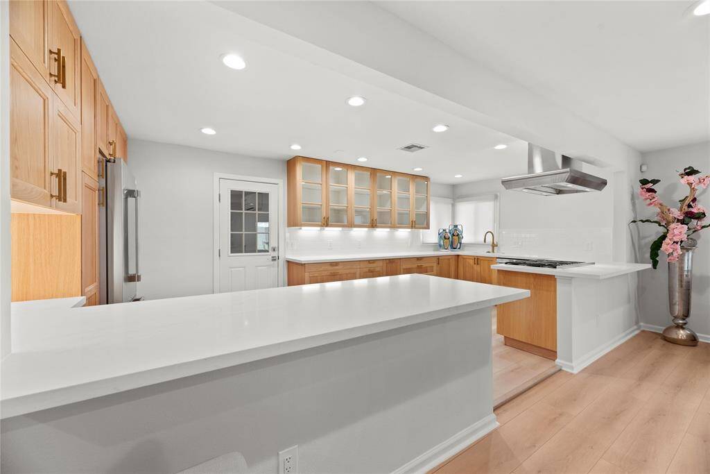 Large island and beautiful finishes.