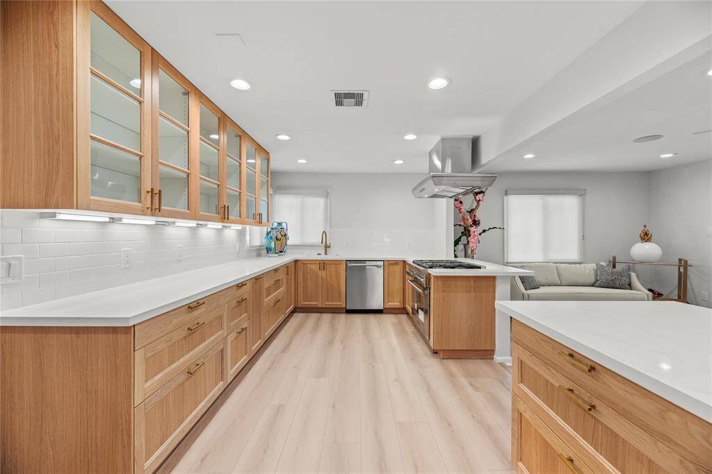 Chef’s kitchen with ample cabinets is perfect for entertaining.