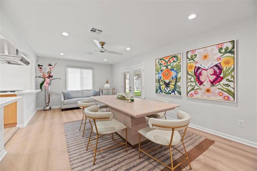 Open layout creates a seamless flow between living and dining.