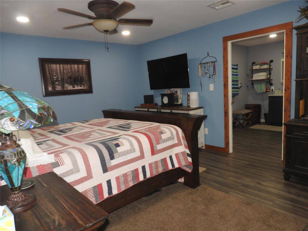 Bedroom has a window facing the carport. All walls are smooth surface as is the ceiling . No popcorn texture on any of the walls or ceilings.