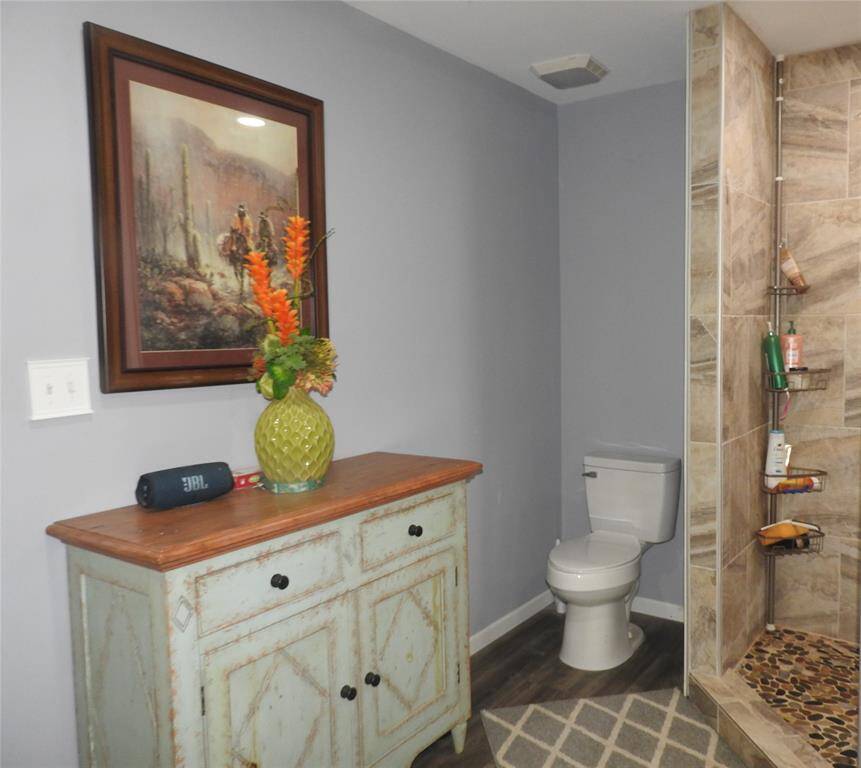 Toilet area opposite side of the shower.