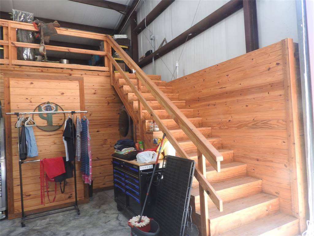 Stairs made of Cedar that leads to the Loft. Great to add an extra bedroom and bath. Access to Plumbing and Electric.