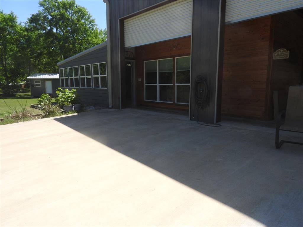 Owner added all this concrete to have an exterior area to sit outside. Lots of money building this Custom Home.