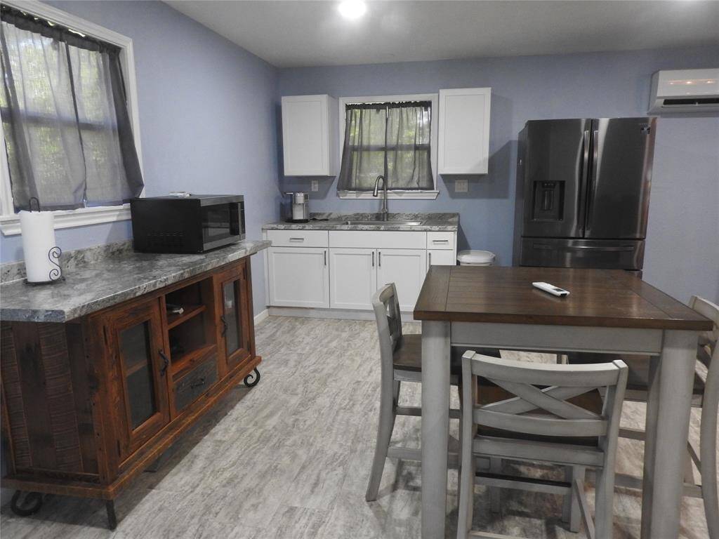 Open concept room. Note all furniture will remain on the premises of this Tiny Home, including appliances.