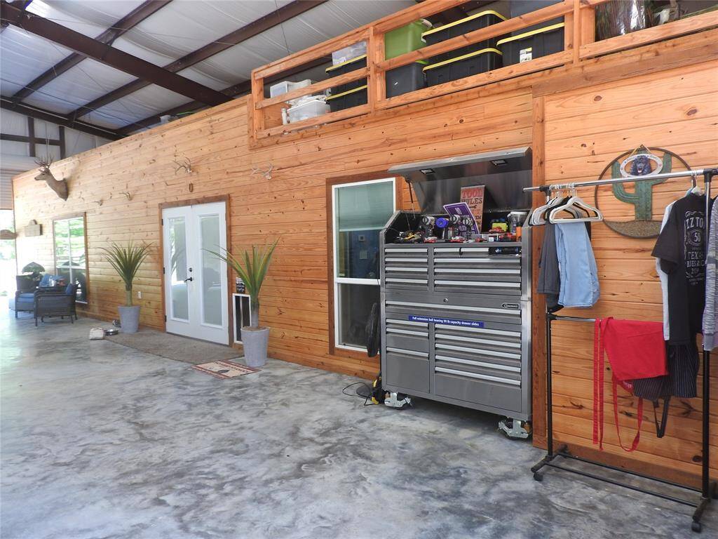 Ample space above this Barndominium to build or add extra enclosed rooms. Best part, this Barndominium is under this carport 365 days a year, out of the weather outside, with commercial metal doors that enclose this home like a secured fort. Protected by a carport that can sustain up to 80 mile winds.