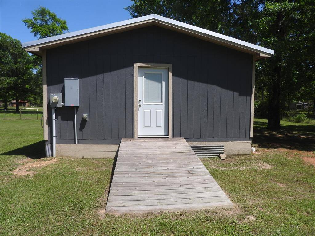 Ramp to enter from side of Tiny Home. To the left is the Generator Hook-Up. On it own Electrical Meter.