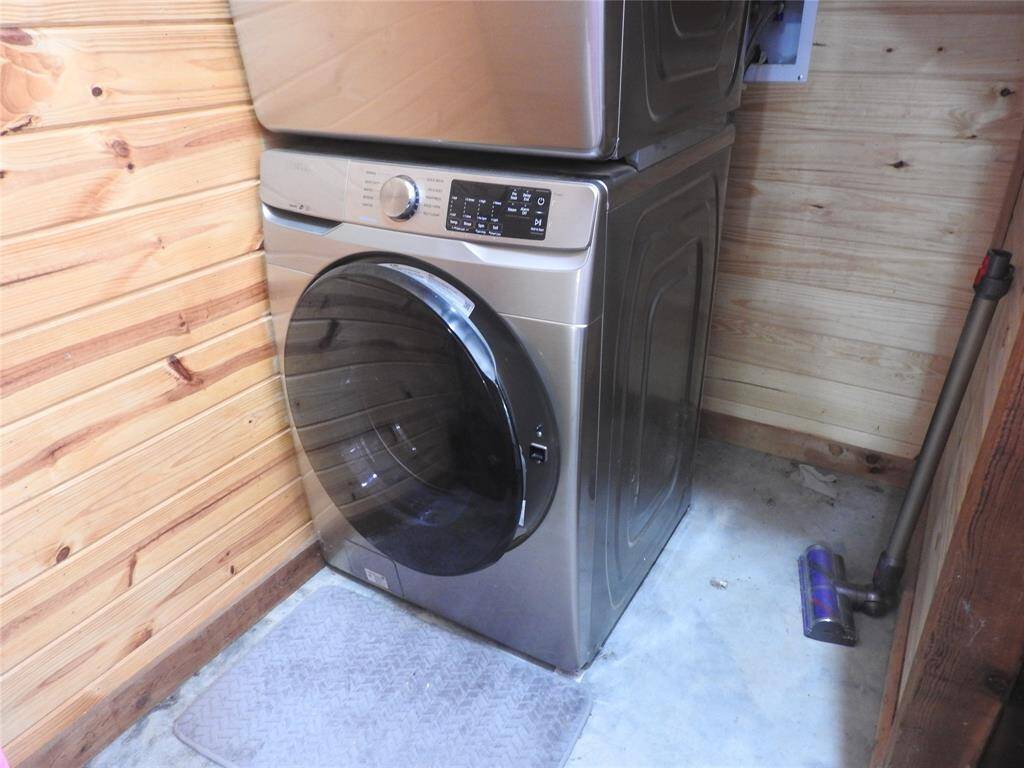 Utility Area behind the stairs leading to the Loft. Washer and Dryer included in sale of the property.