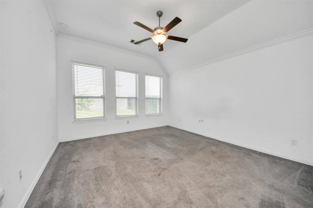 Retreat to the luxurious primary suite, a spacious and serene haven designed for comfort and relaxation. The bedroom offers plenty of room for a king-sized bed and additional seating, with large windows that bring in natural light and create a calming ambiance.