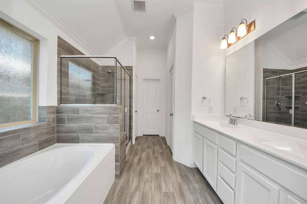 Step into the spa-inspired en suite bathroom, where thoughtful design and upscale finishes create a true owner’s retreat.