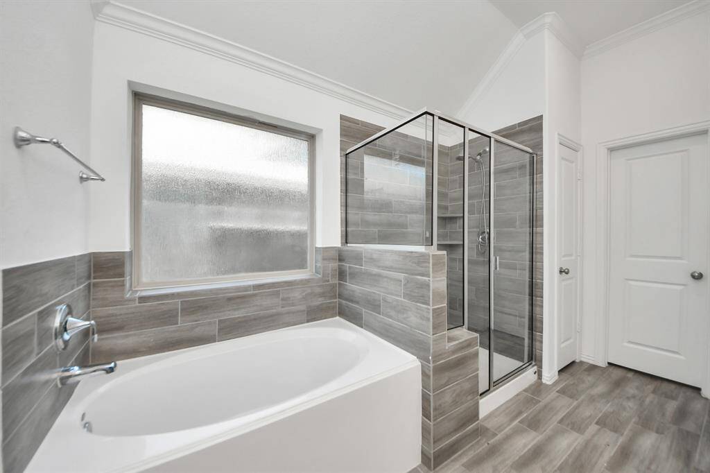 Unwind in the deep soaker tub, perfect for a quiet evening escape, or enjoy the convenience of the separate walk-in shower.