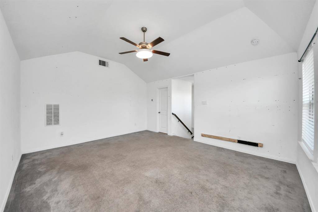 Upstairs, you'll find a large, versatile gameroom along with a half bath.