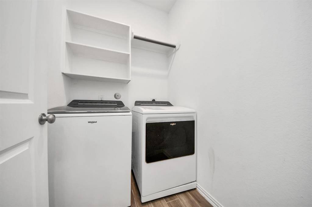 The home features a dedicated in-house laundry room designed with both convenience and efficiency in mind.