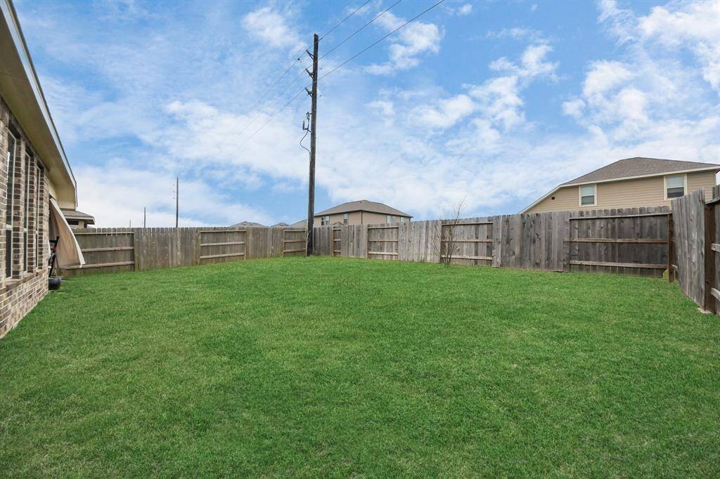 Step outside into the beautifully maintained private backyard, offering plenty of room for outdoor entertaining, weekend barbecues, or simply enjoying a peaceful evening under the stars.