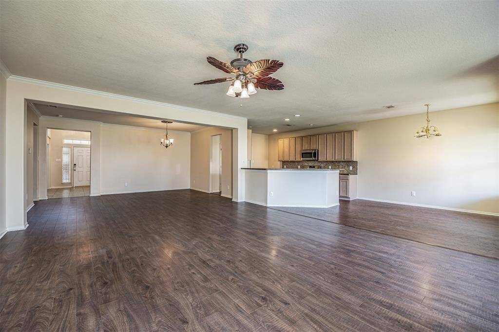 kitchen opens up to living and ding room