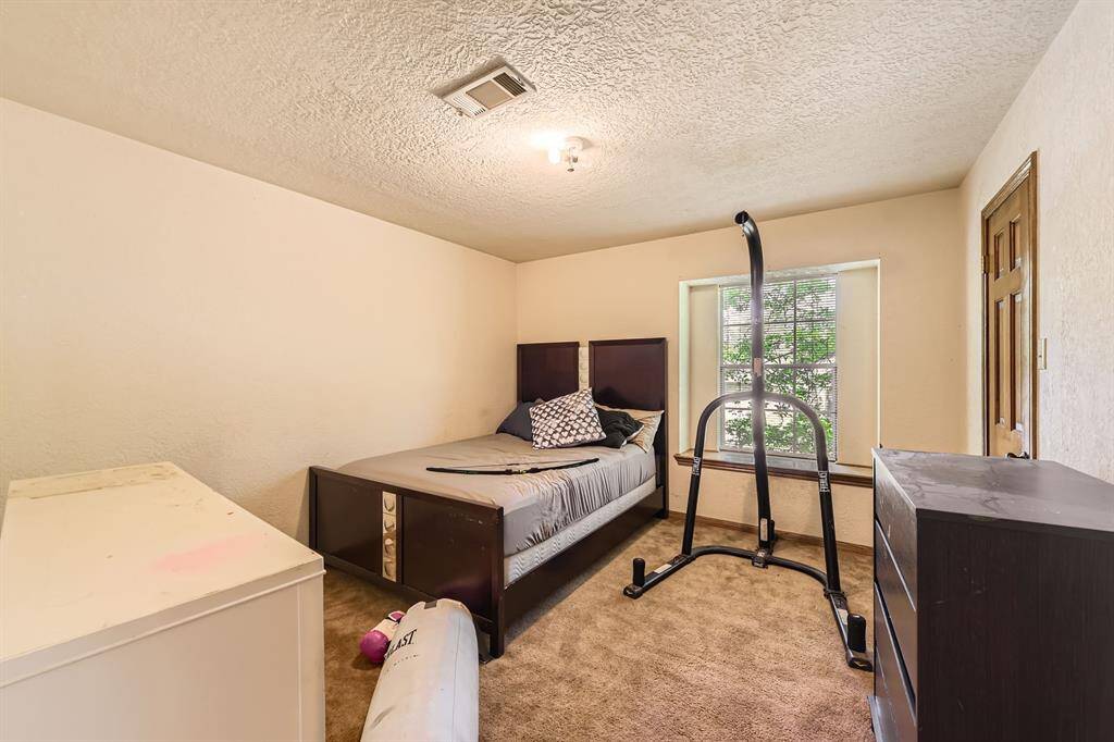 One of the secondary bedrooms with space for moving around.